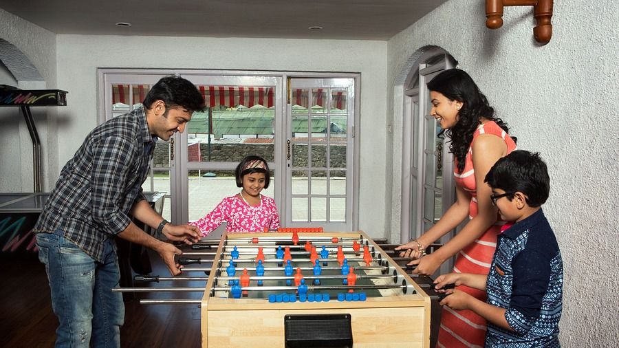 a family playing Foosball 