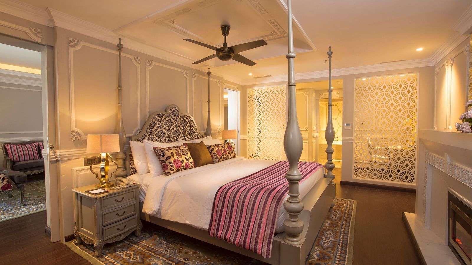 Suite at Fragrant Nature Munnar with cushions arranged, sheets neatly made, and a warm, cosy setting