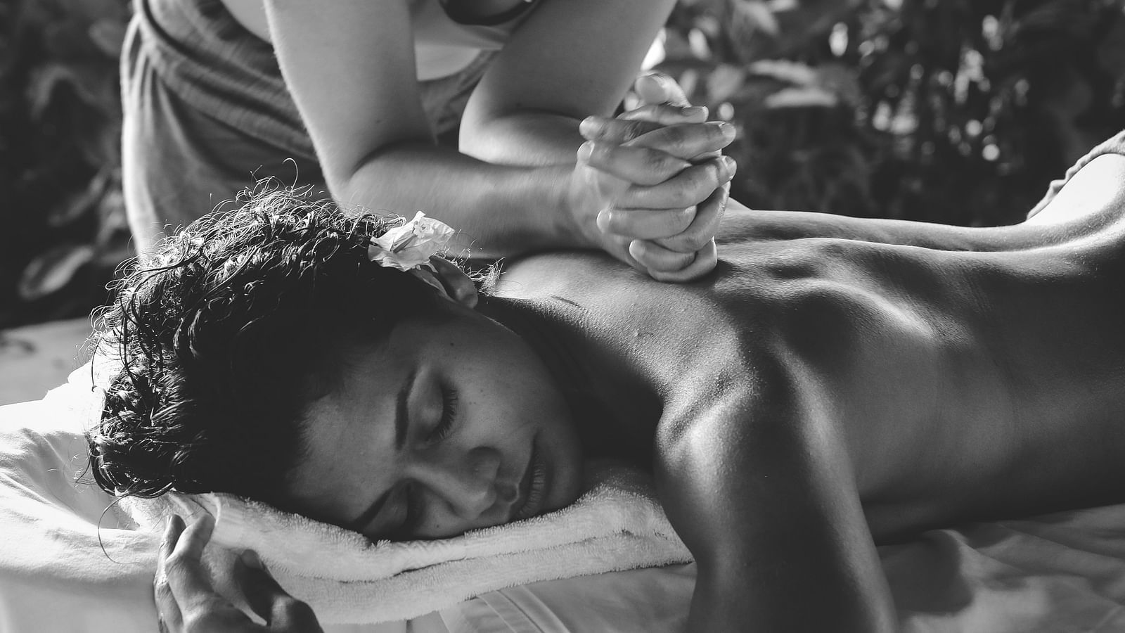 an image of a woman getting a back massage - Kerala Ayurveda
