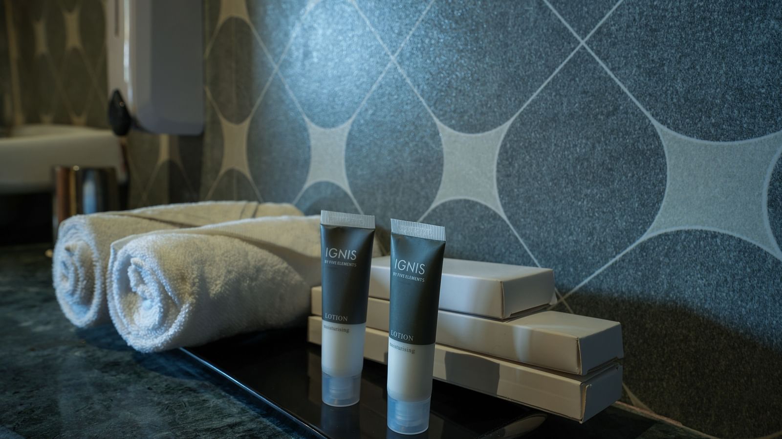 The family room's bathroom with neatly arranged towels and toiletries at Summit Green Lake Tea Resort & Spa, Kaziranga