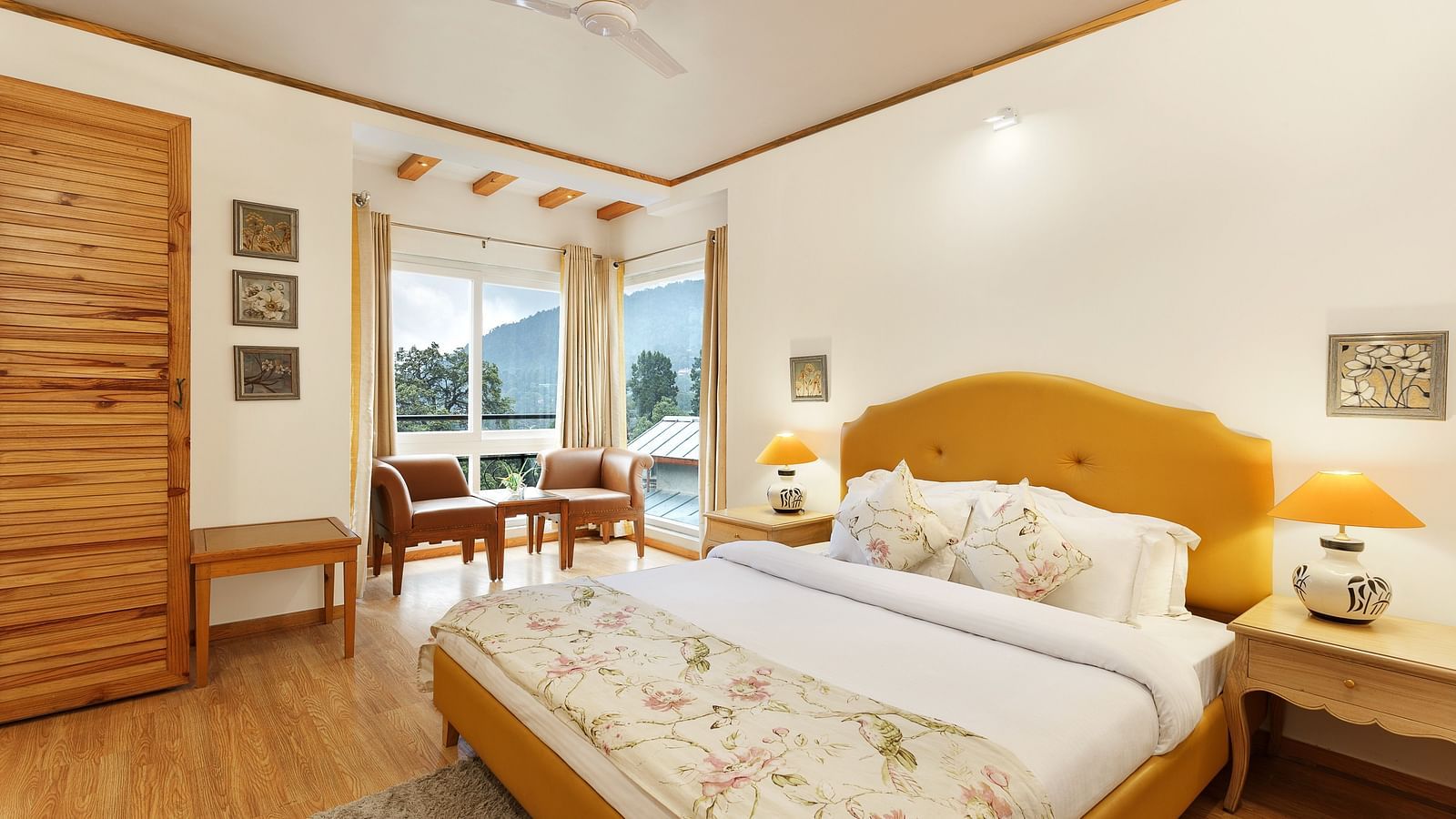 A cosy room with plushy bed, table lamp with makes the ambience homely - Pinewood Nainital 