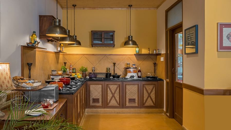 A well-equipped kitchen at Fishermen's Lodge, Bhimtal, featuring modern facilities for a convenient cooking experience.