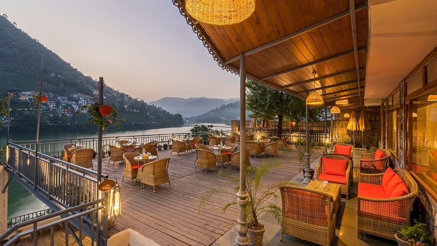 L-Attitude Deck at Fishermen's Lodge, Bhimtal, featuring a stunning view of the lake, perfect for relaxation and enjoyment.