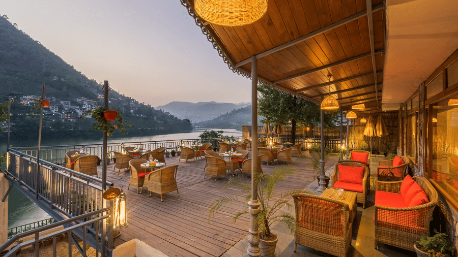 L-Attitude Deck at Fishermen's Lodge, Bhimtal, featuring a stunning view of the lake, perfect for relaxation and enjoyment.