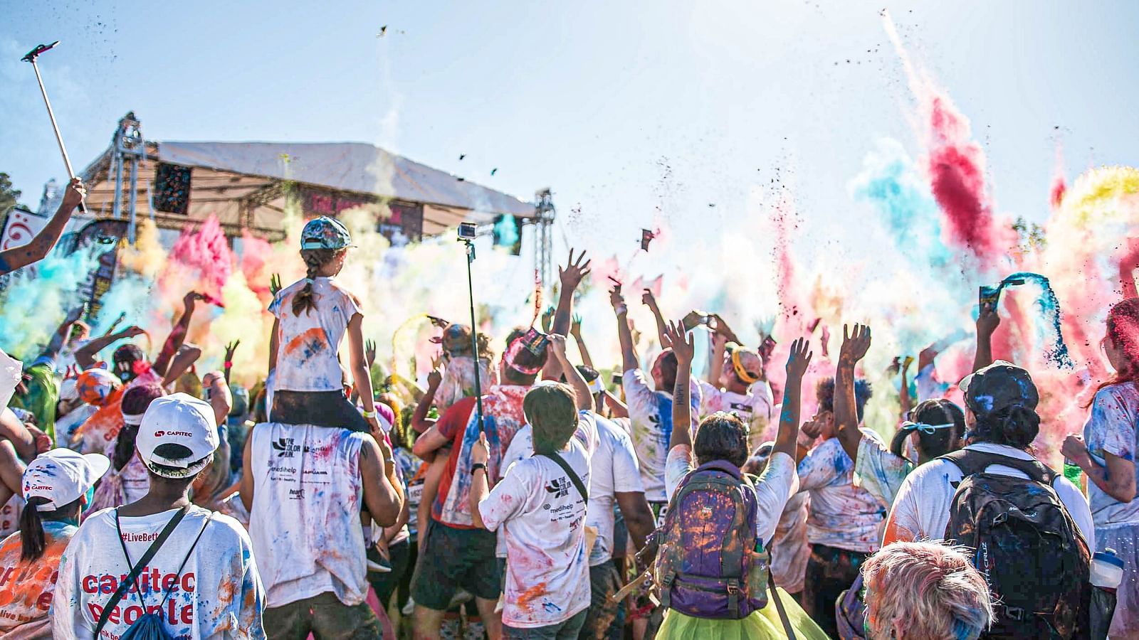 an image showcasing a group of people having fun playing wtih colours2