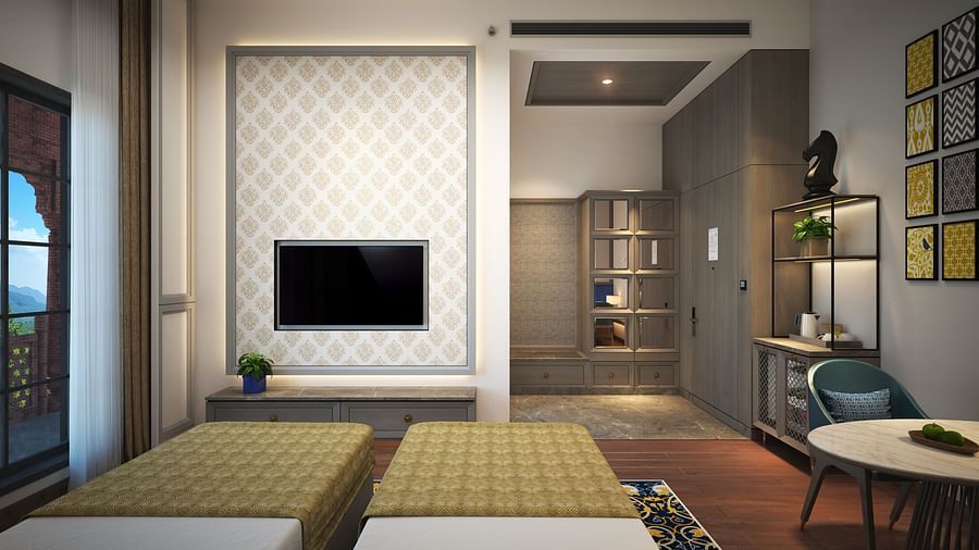 An image of a hotel room in Amristar with twin beds, wall-mounted television and a cosy table - Sarovar Premiere, Amritsar