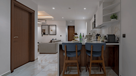 Executive Suite with kitchen island, bar stools, and open floor plan at The Pelican Hotel, a luxury hotel in Accra