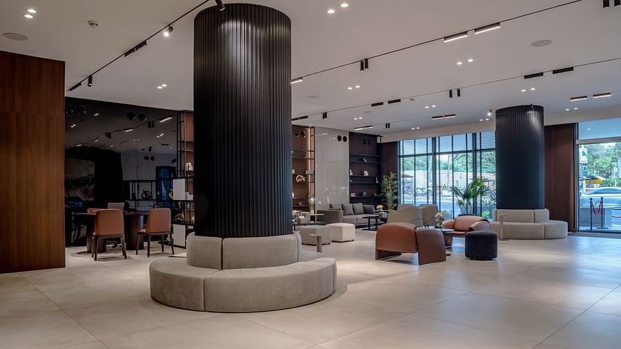 A modern hotel lobby with stylish seating, contemporary lighting, and decorative accents. - The Pelican Hotel, Accra