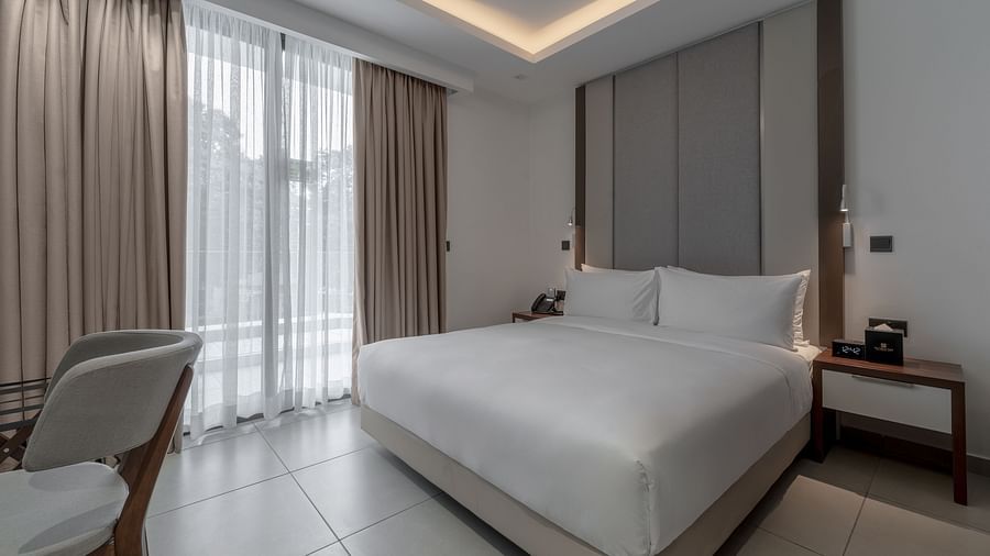 Luxurious Premier Suite offers a king bed, modern decor, and elegant furnishings for a relaxing stay. - The Pelican Hotel, Accra