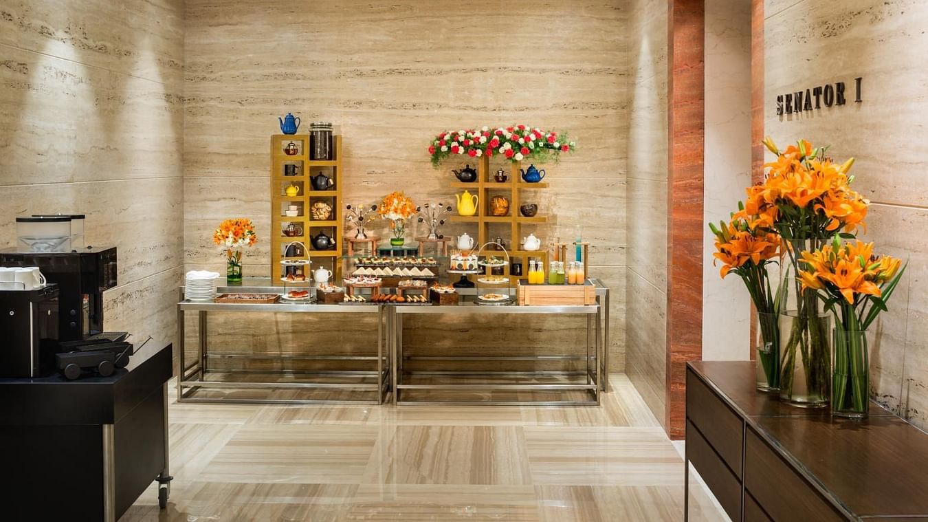 Stylishly arranged pre-function area with coffee setup at The Residency Towers Coimbatore