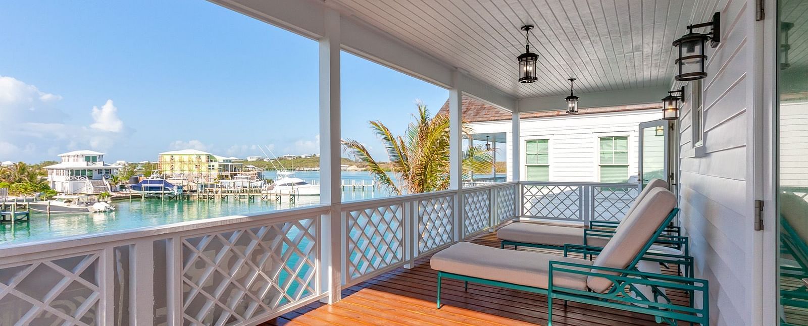 comfortable chairs on the wooden dock with the sea view at Abaco Inn.