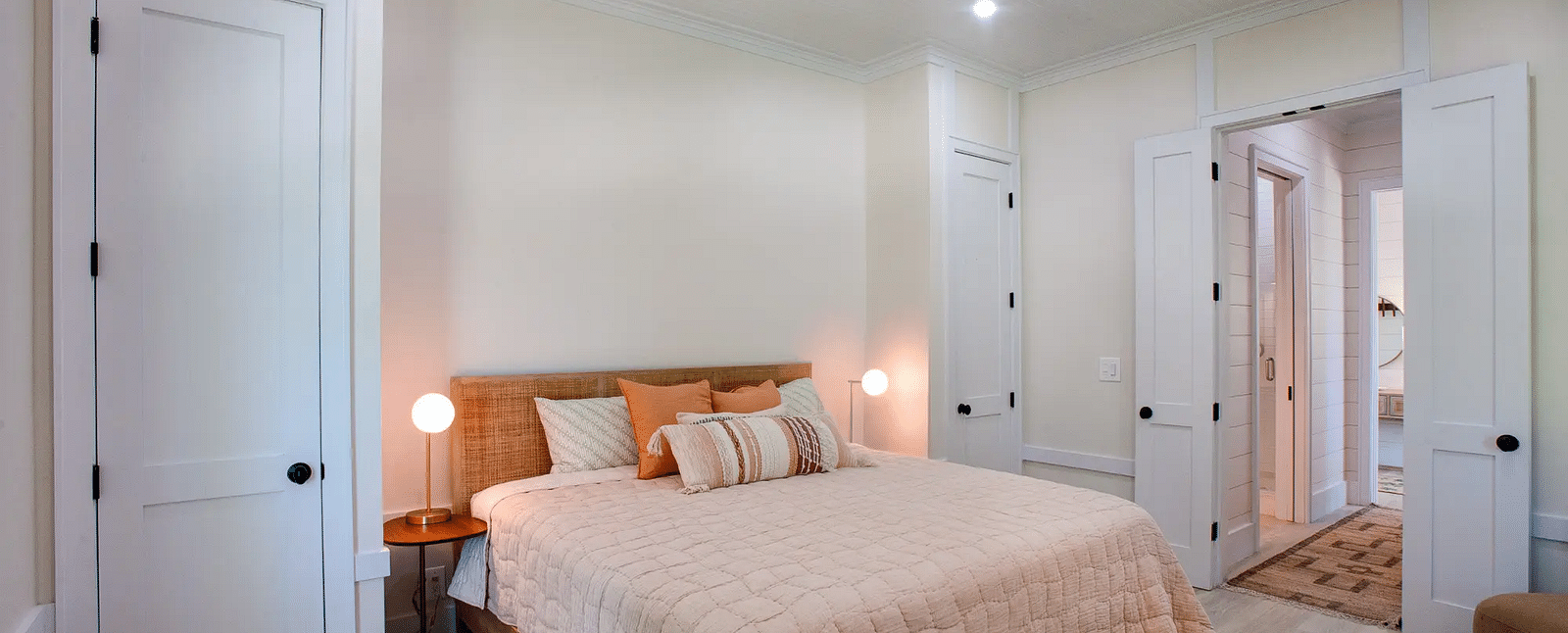 Bedroom with a double bed, bedside lamps, and a ceiling fan | Abaco Inn