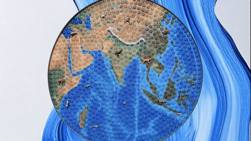 Satellite-style map of Asia and the Indian Ocean inset over blue paint swirls on a white background.