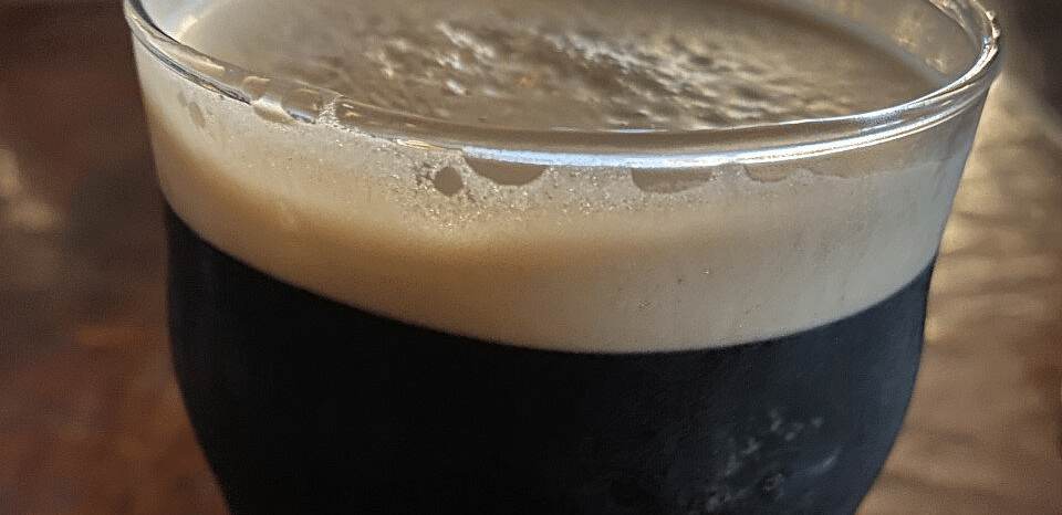 A glass of frothed coffee