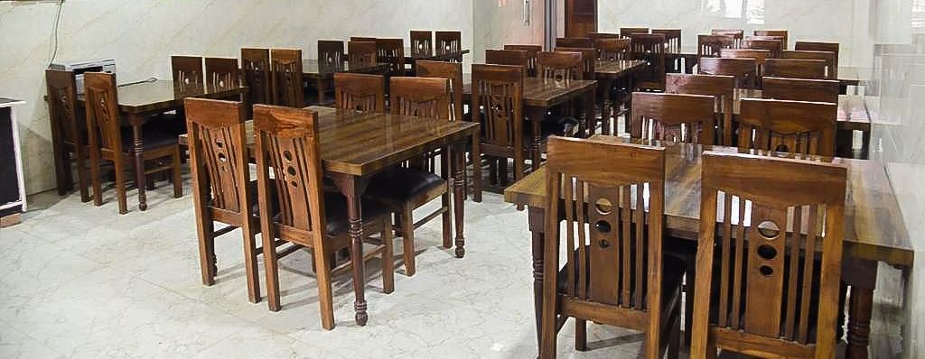 Tables and chairs arranged in Agra Prasadham