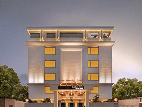 Illuminated facade of Karol Bagh, with sky in the backdrop.