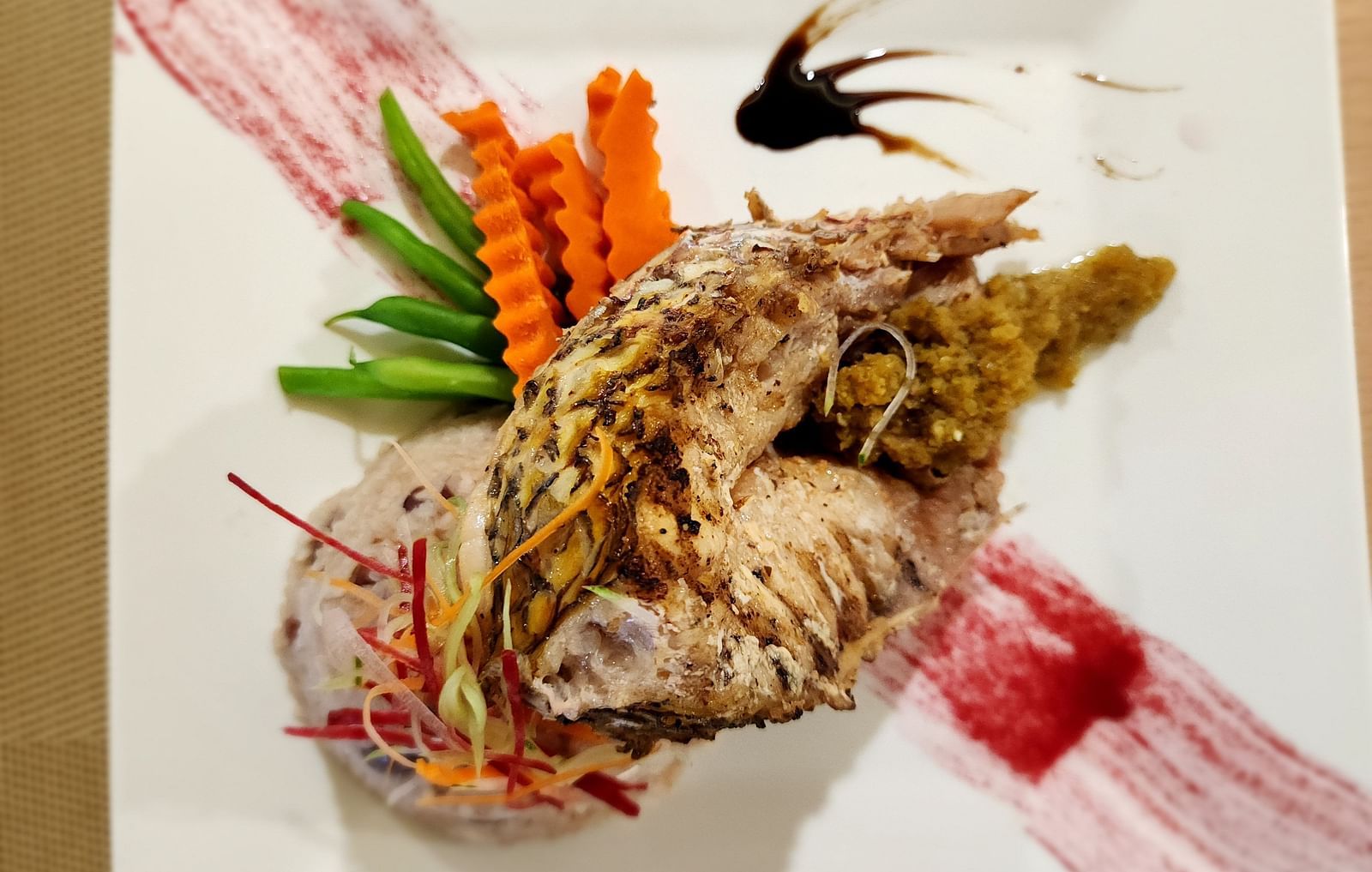 A lobster dish served with a side of sauce - Hotel 39, Jamaica