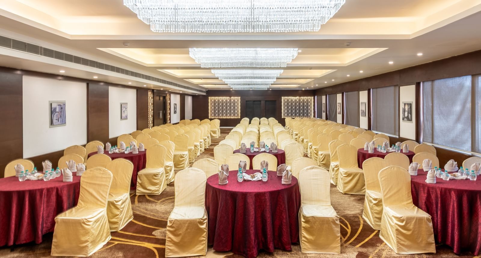 Banquet hall arranged with round tables and chairs, perfect for social or formal dining events
