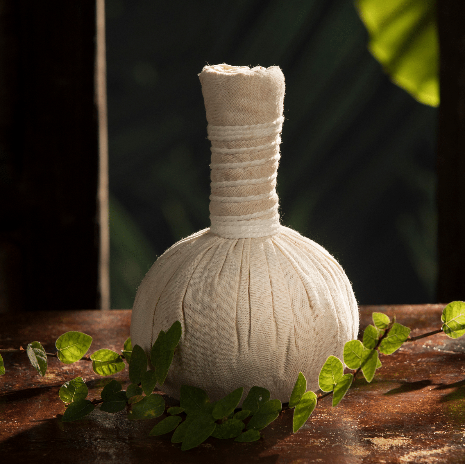 a close up shot of a potli kept on a table - Rhythm Kumarakom