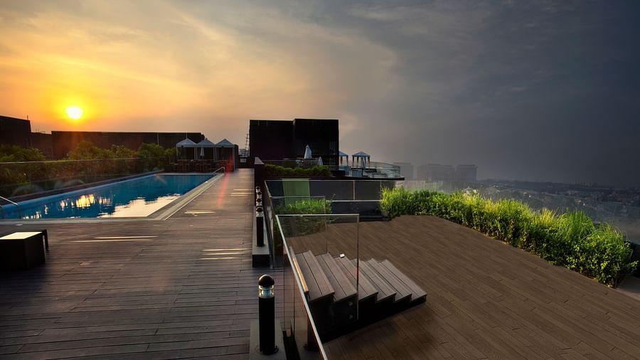 rooftop pool during sunset at The Waverly Hotels and Residences