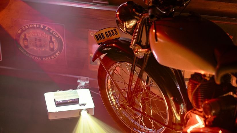 Top-side angle view of a bike with colorful focused lights highlighting it at The Residency Towers Chennai.