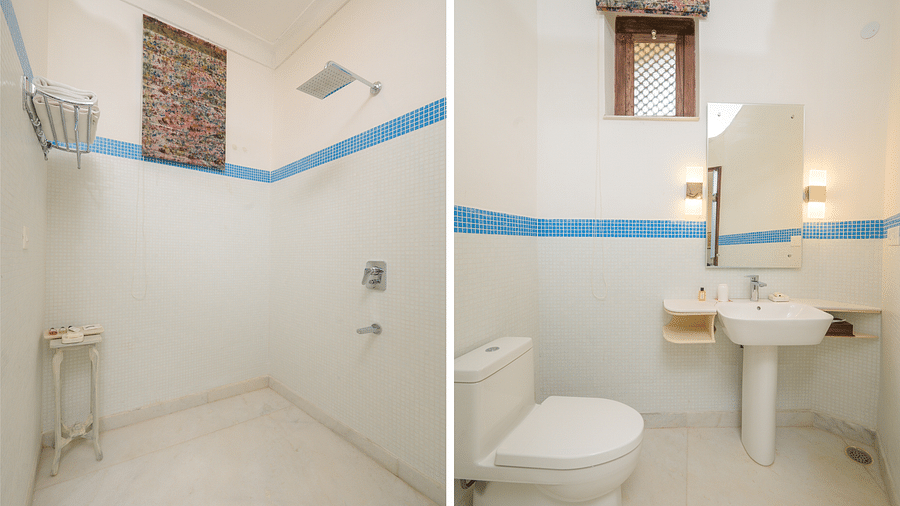 A collage of a bathroom featuring a shower on one side and a toilet and sink on the other, both with blue accent stripes and white fixtures - Tijara Fort-Palace - 19th Century, Alwar.