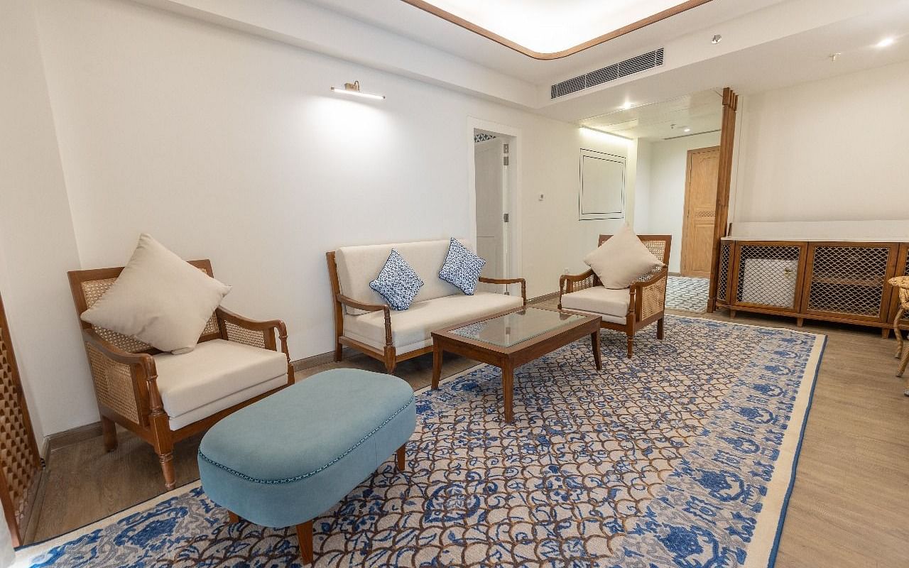 A close up shot of the couch set placed over the long patterned rug in the separate living area at Bhagirathi by RDB Atishay.