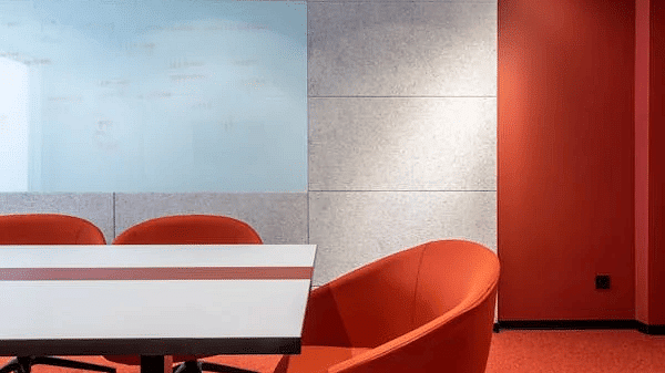 Image of a room with three chairs and a table.