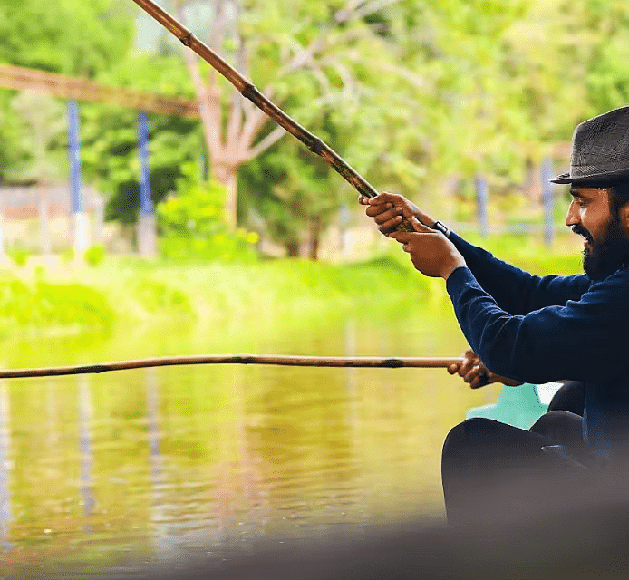A man with a hat fishing 
