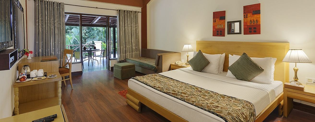 An image of a bedroom with king size bed, wooden ceiling where a fan is hanged,  cabinet and tables, etc. - The Riverview Retreat, Corbett