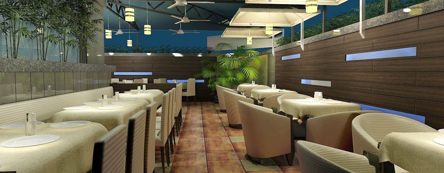 Outdoor dining area with chairs and tables arranged neatly, surrounded by plants at Oriental Aster, Mumbai.