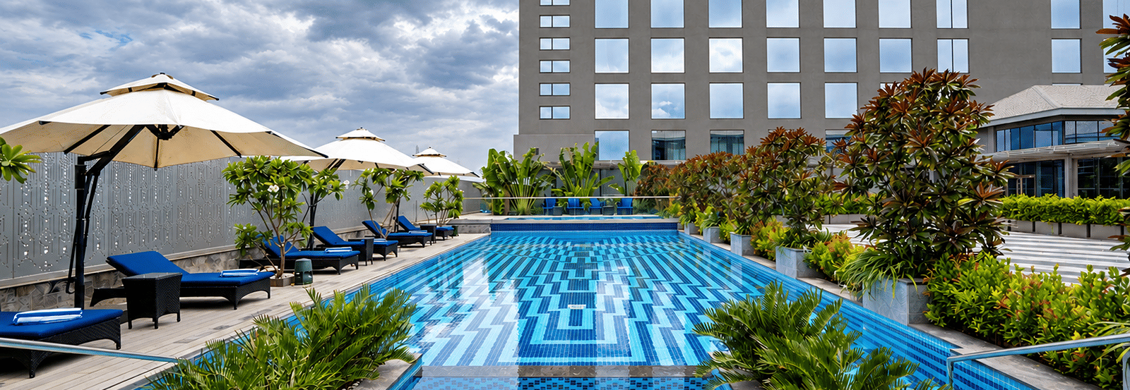 Modern Rooftop Pool Under Cloudy Skies