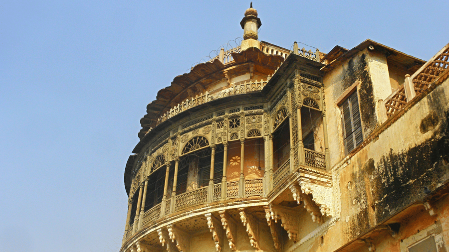 Ramnagar Fort with arched balconies, weathered walls, and heritage structure under clear sky.