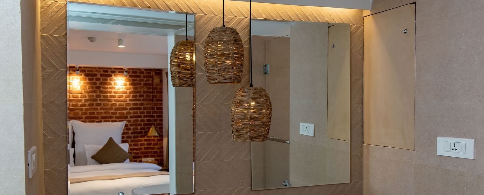 A washroom with bamboo lamps hanging from the ceiling at the Nepali Suites - The Nanee