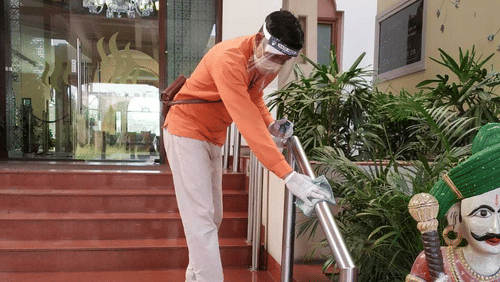 heritage staff santising the resort