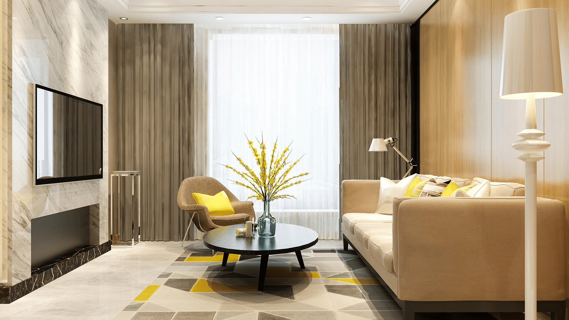 Living room of Lime Tree Hotels & Service Apartment Private Limited featuring a geometric patterned rug, a sofa, and a wall mounted television.