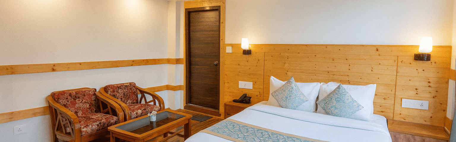 Deluxe hotel room in Gangtok with wooden interiors