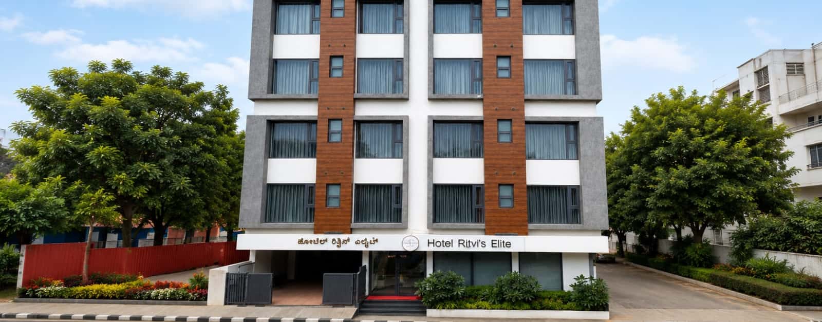 Front facade and entrance of Hotel Ritvi's Elite, Mission Road, Bengaluru