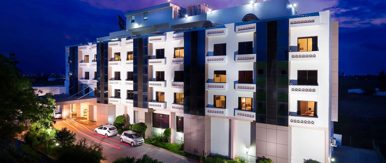 The exterior facade of a hotel building illuminated by warm lights - Regency Tuticorin by GRT Hotels, Best Hotel in Tuticorin