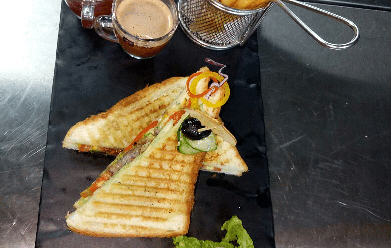 Grilled cheese sandwich with fries and dip.