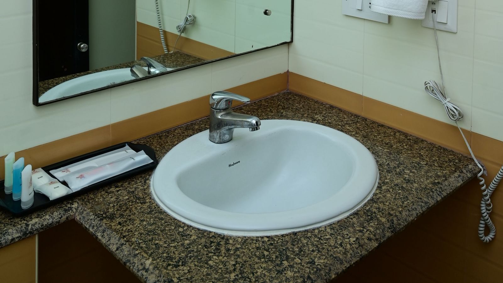 Mirror and sink at the Washroom at Executive Suite at Sterling Keys by TGI 