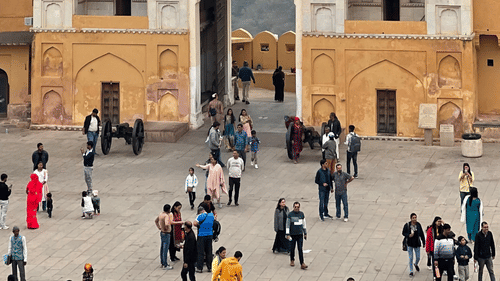 Suraj Pol, the main entrance of Amer Fort with bustling tourists.