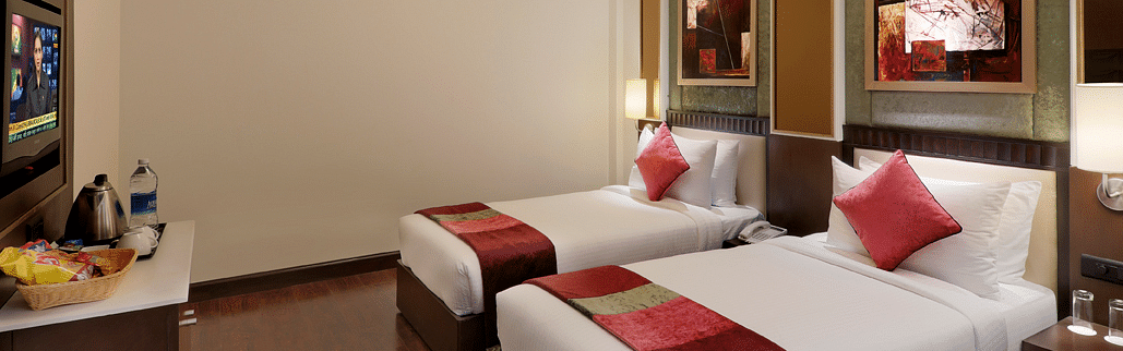 view of twin bed in Premium twin room of Inde Hotel Vista Woods, Gurgaon 