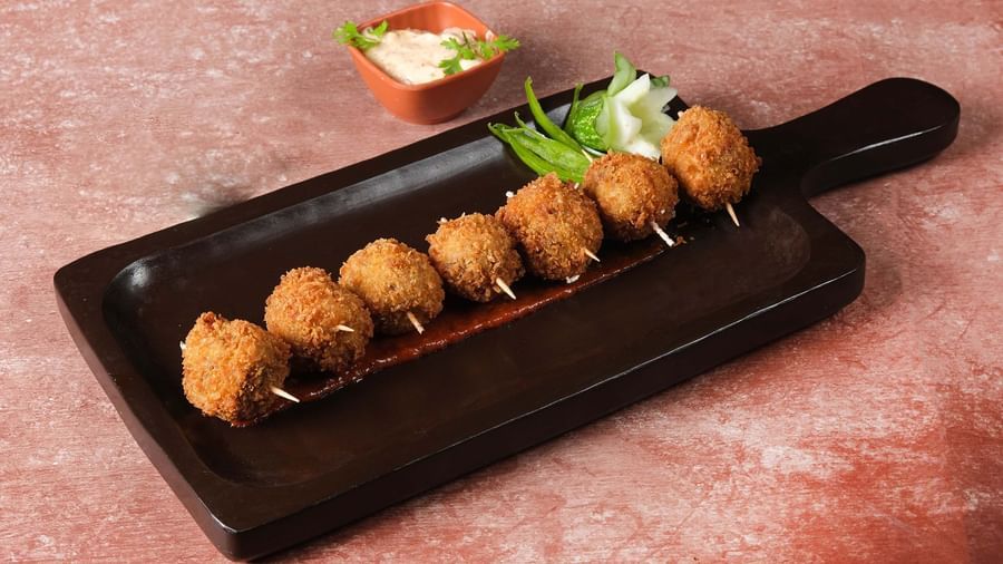Crispy Fried Balls served with chutney at Monday Hotels Amalapuram Heights.