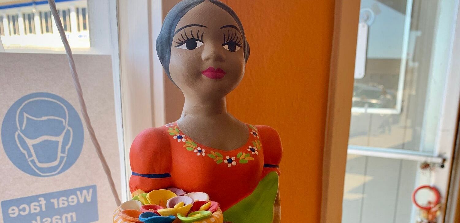 A clay doll dressed in ethnic clothes