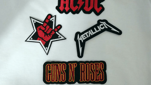 Rock band patches featuring AC/DC, Guns N' Roses, Metallica logos, and a star with a hand rock gesture.