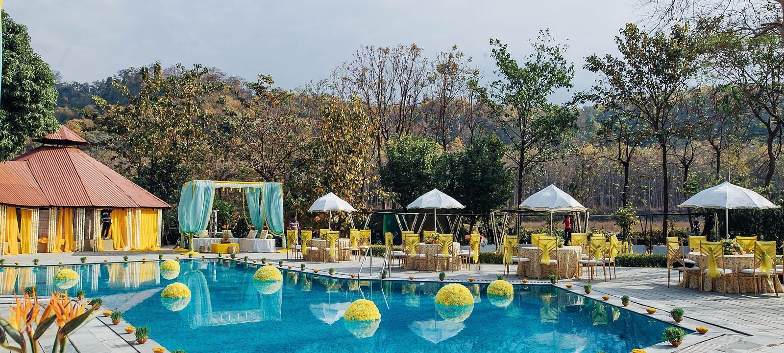 Outdoor swimming pool beautifully decorated with flowers.