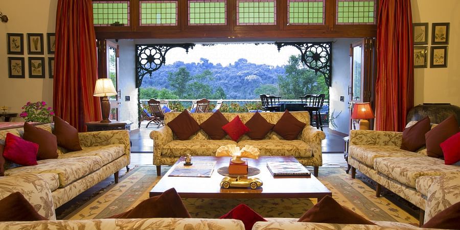 Image of a living room with sofas  royal decor and beautiful views