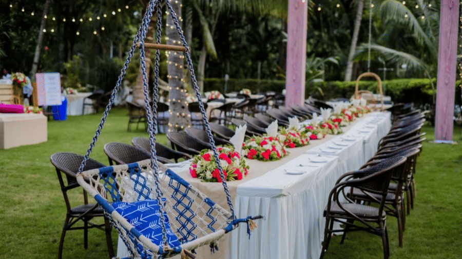 An event space at Avana Resorts, featuring decorated chairs and tables set for an event.