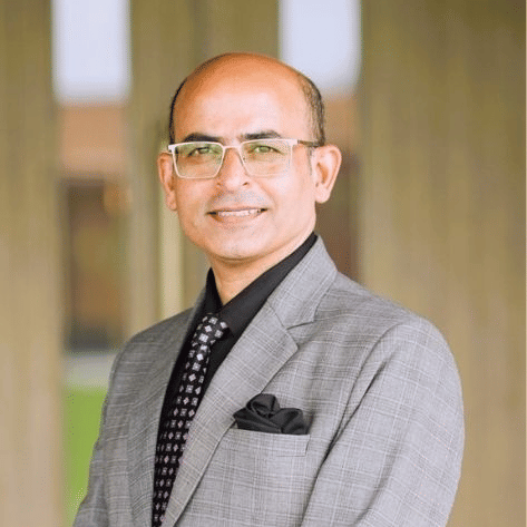 Area General Manager portrait in formal attire at Pride Hotels Group.